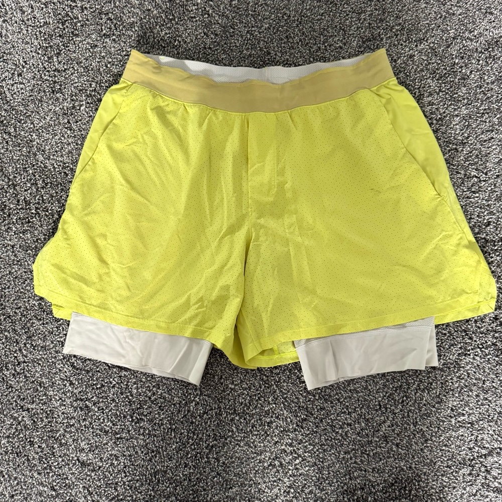 Lululemon Athletica ventilated Tennis yellow Shorts with Black Underlayer
